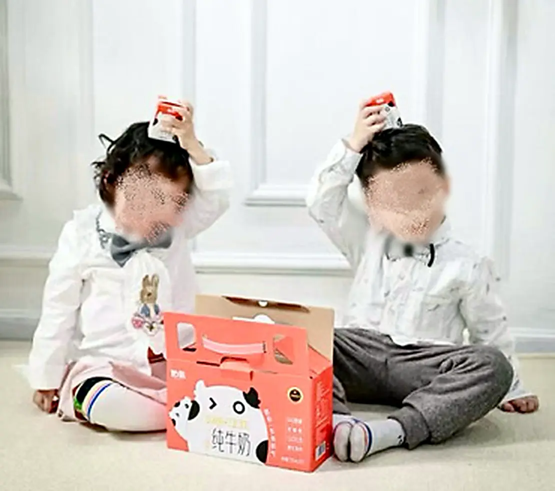 Children holding the relaunched milk product
